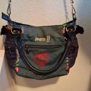 Stylish Denim Shoulder Bag with Black Accents and pockets. Colorful And Stylish